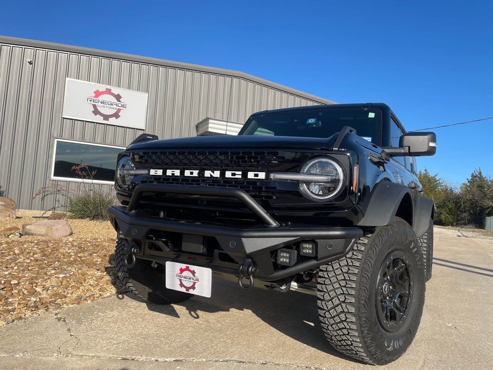 Black Ford Bronco with aftermarket front bumper and winch at Renegade Customs