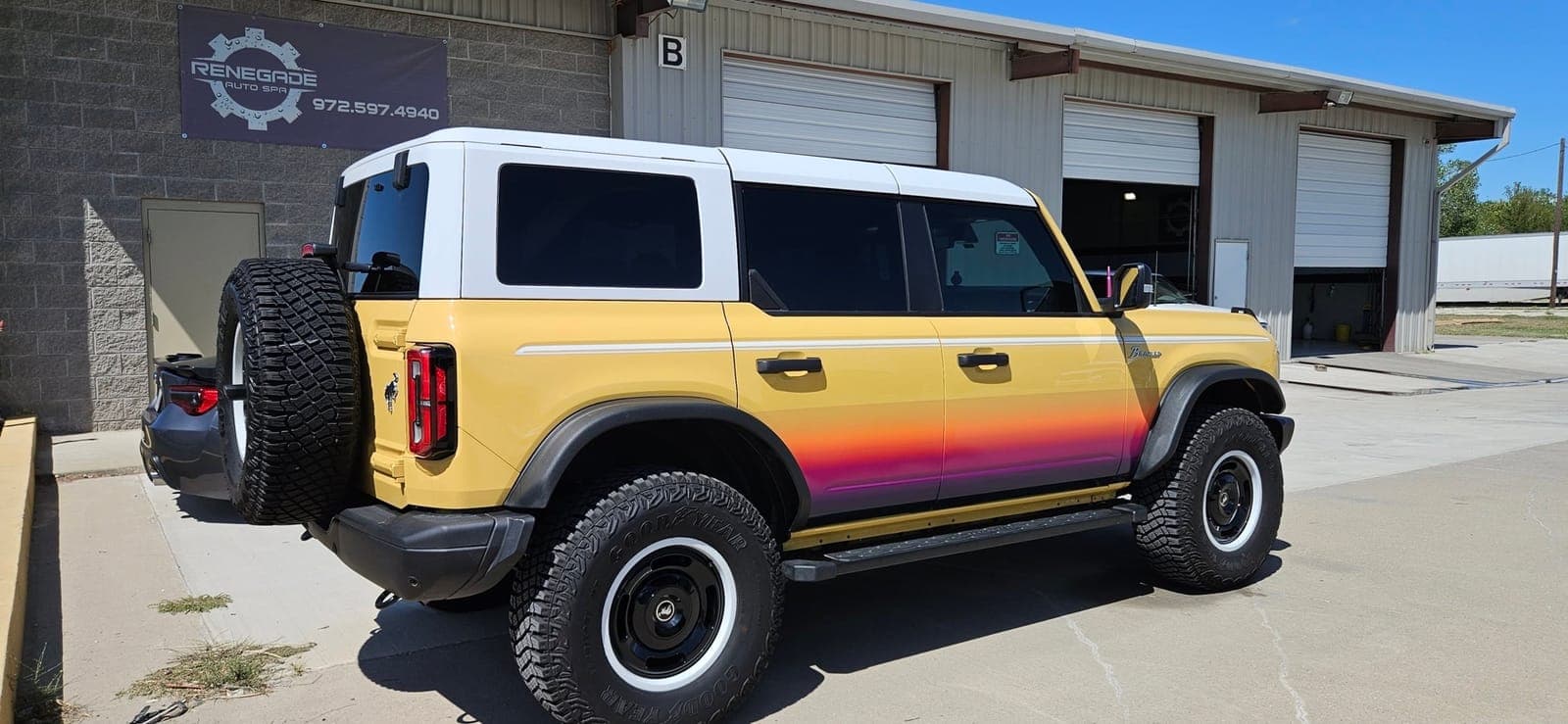 Ford Bronco with a custom sunrise fade color-change wrap by Renegade Auto Spa