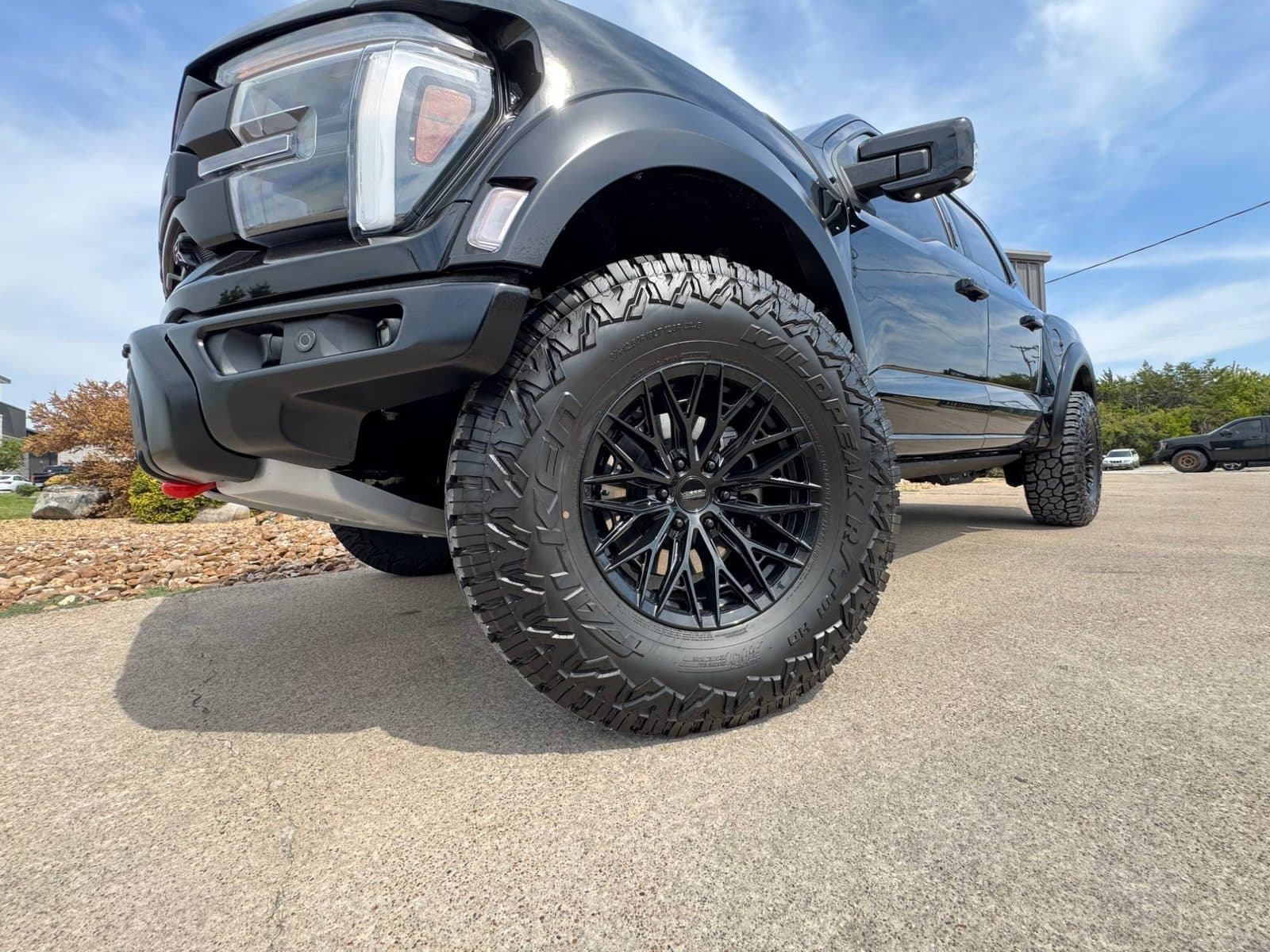 Black Ford F-150 Raptor R on gloss black Vossen wheels and 37-inch Falken Wildpeak tires at Renegade Customs, Rockwall TX