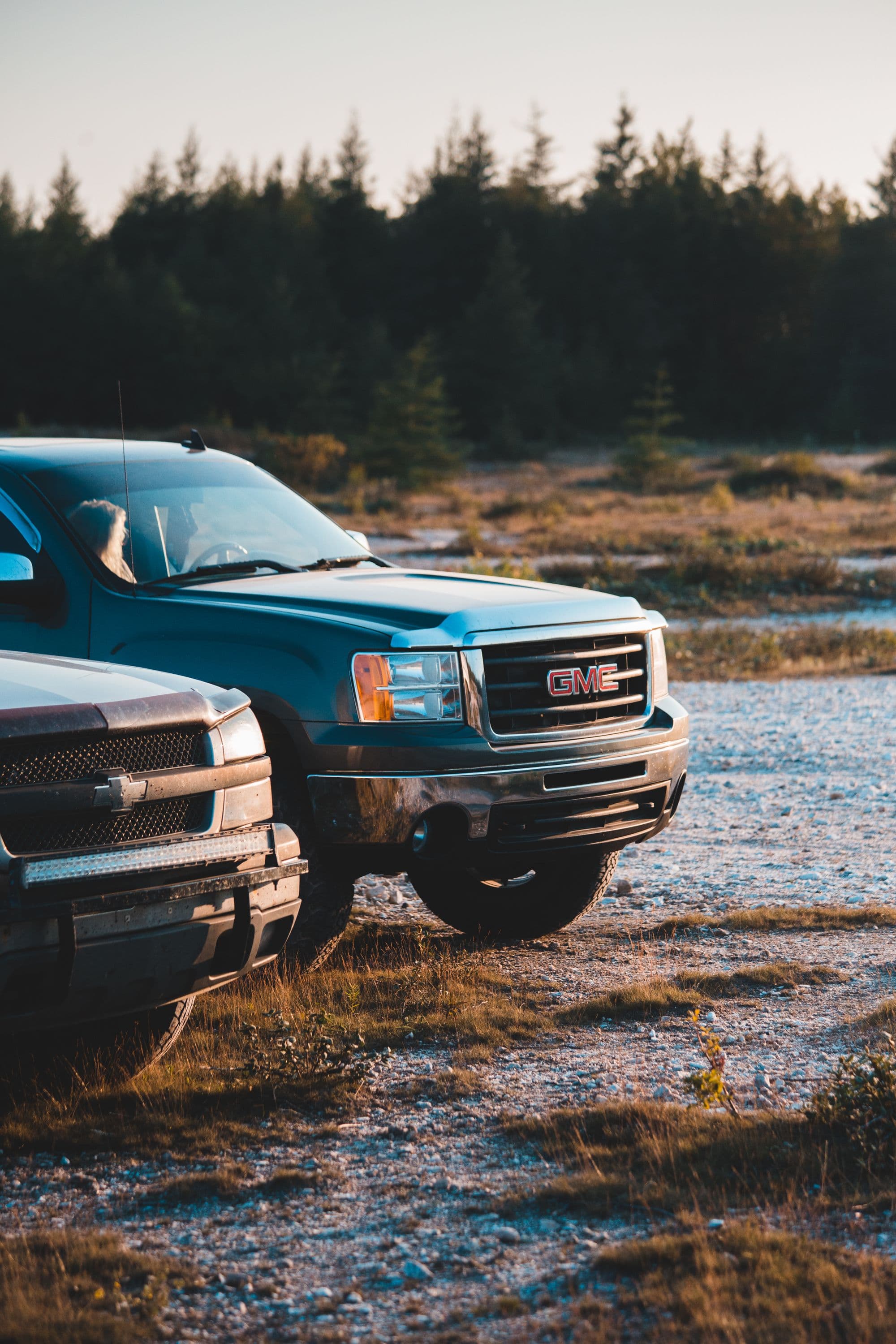 Kitted-out pickup trucks at golden hour